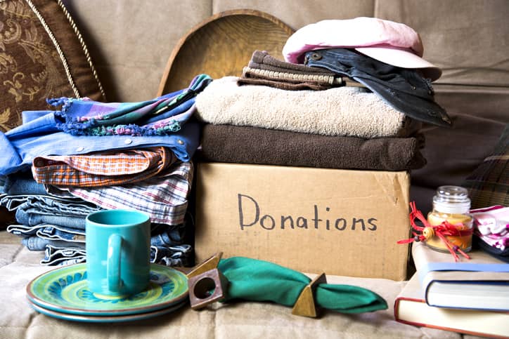 Charity donation box with clothes and household items.