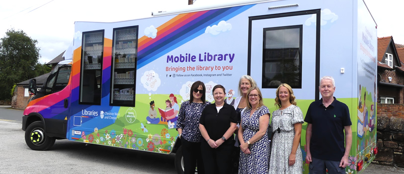 Council Leader and Cabinet Member for Wellbeing, Cllr Louise Gittins, with staff from the Council's Library Service and the new electric mobile library vehicle.