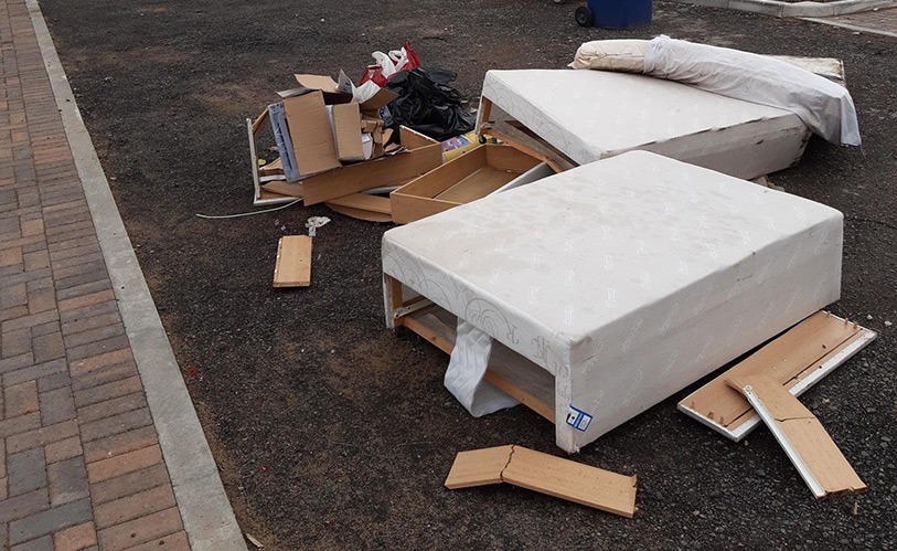 Fly-tipping in Ellesmere Port, with bed base, mattress and draws.