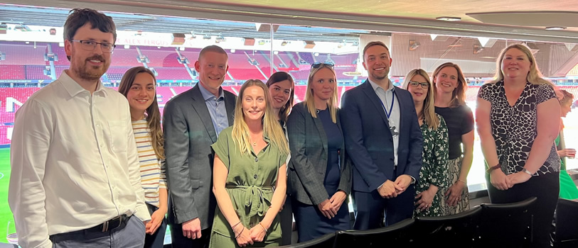 Colleagues from Cheshire West and Chester Council stood in a group smiling at the camera.