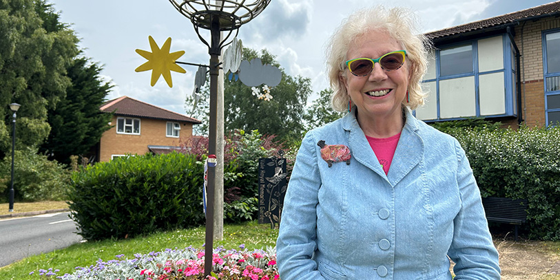 Viv Gee, interim chairman of the Age-friendly Cheshire West Partnership, smiling in a garden