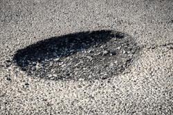 Large pothole with no outline 