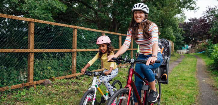 Parent and child cycling to school