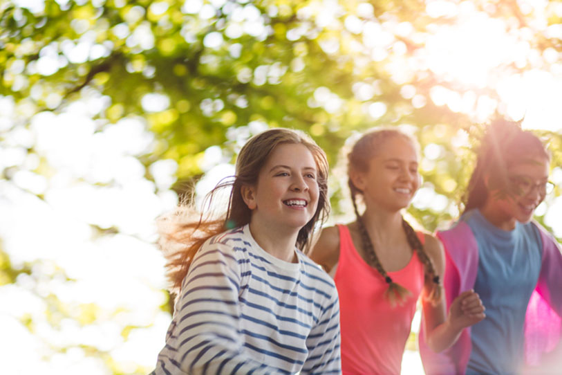 A group of girls playing outdoors.